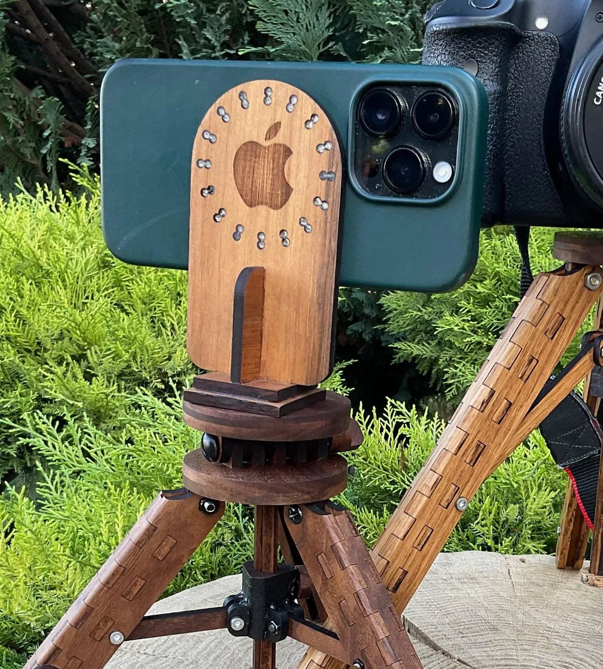 Wooden MagSafe mount holding an iPhone on a tripod