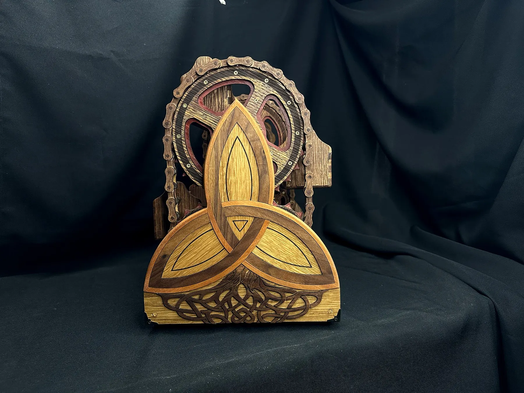 Alchemy Spice Carousel: carousel side frame with leaf-shaped brace