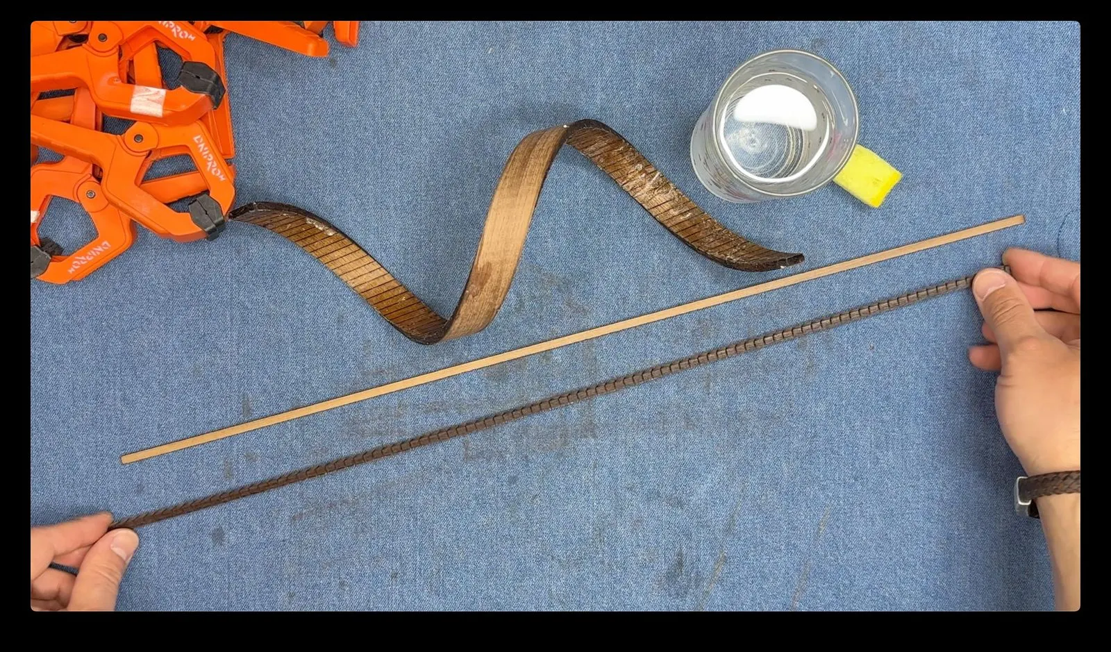 Gesture-Controlled DNA Lamp: applying finish to the bent wooden strips