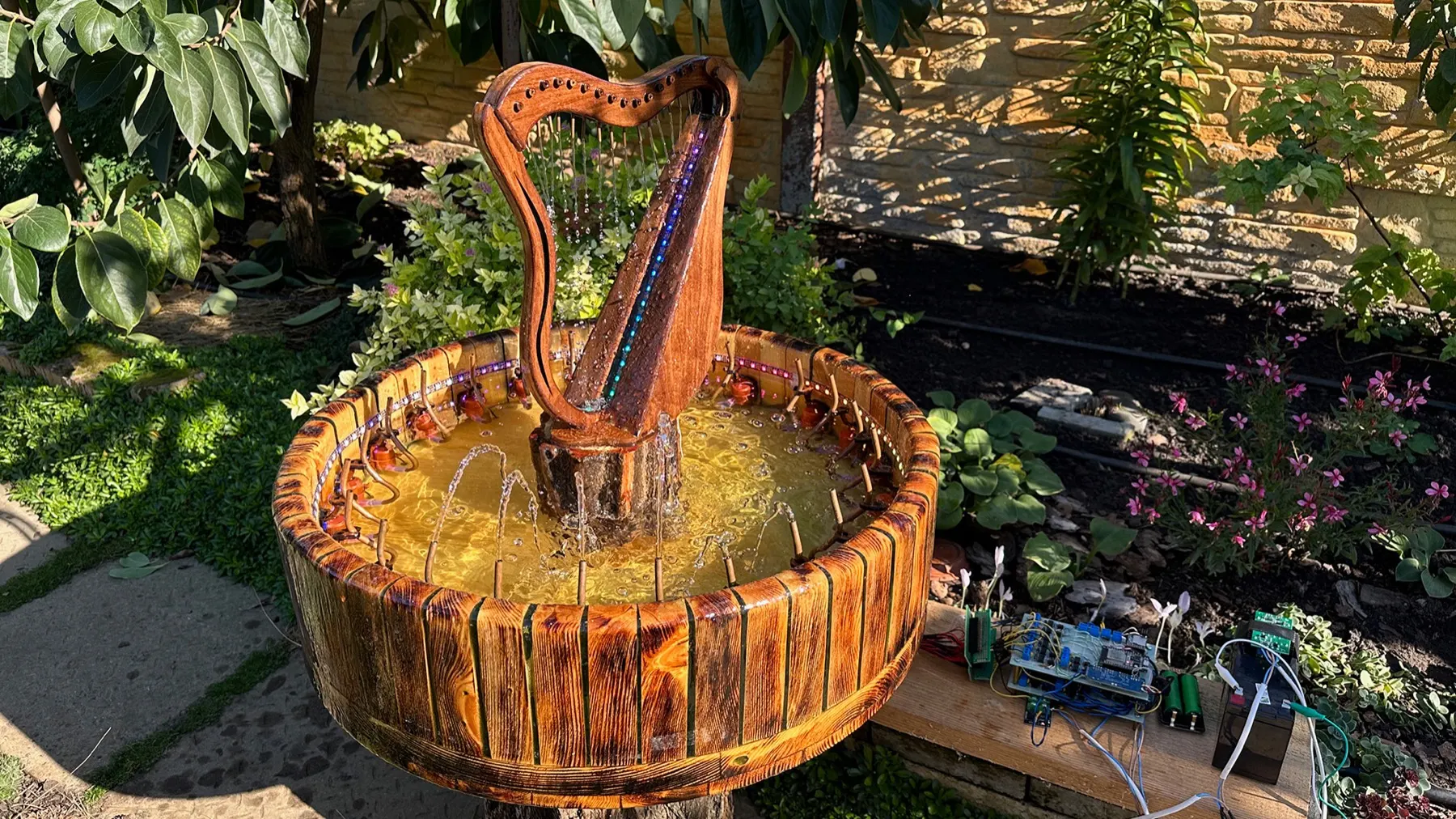 Animated Wooden Fountain: finished walnut harp in the pine basin