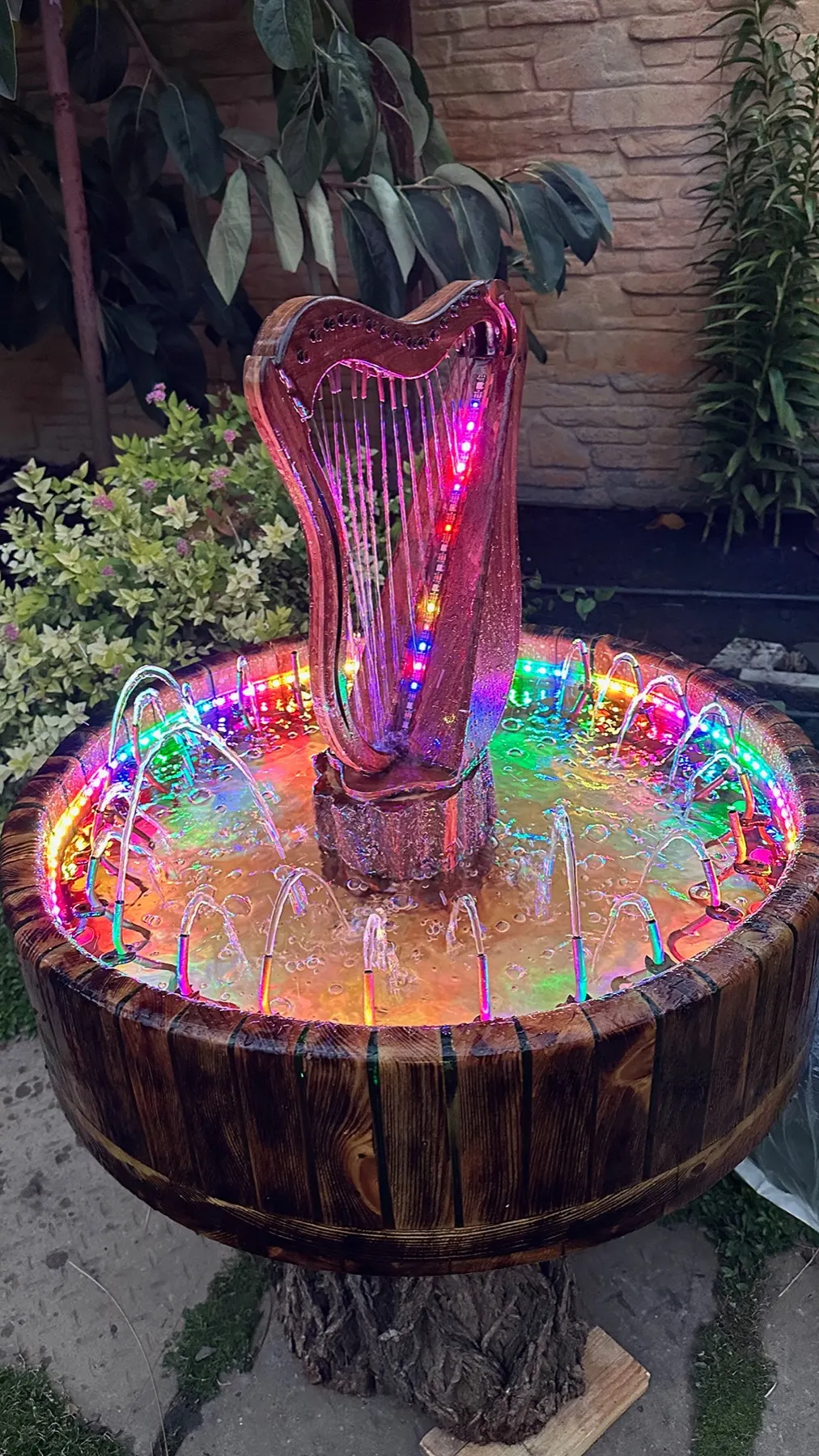 Animated Wooden Fountain: purple water-and-light sequence